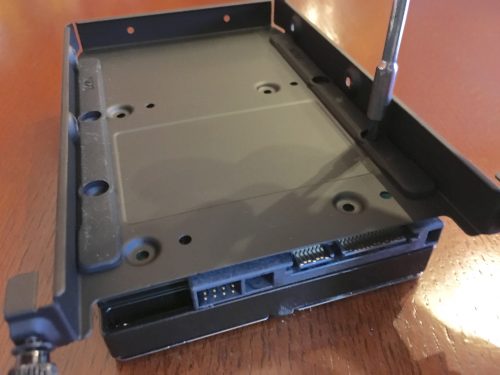 Here's how to mount a 3.5" hard drive to the bottom of the drive sled. You can also mount a 2.5" drive under or above (but not both) and a 3.5" drive on top.